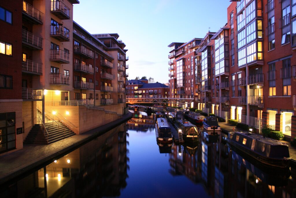 Night scene showing canals and waterfront apartments
