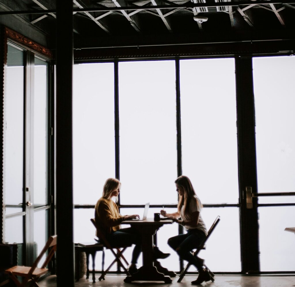 Two people discussing Internal grievance and complaint in office
