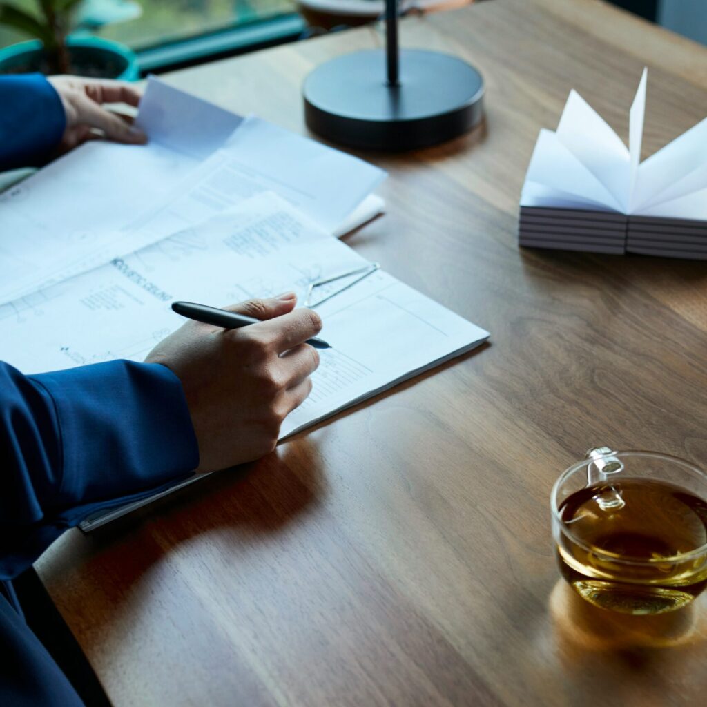 Office desk and papers checking Limited Liability Partnership agreement