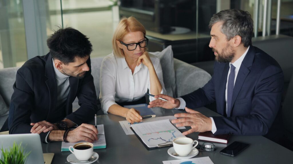Three director and shareholders discussing conflict of interest