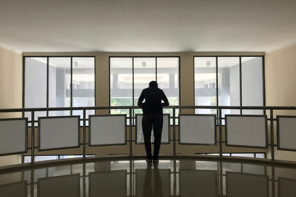 Man on a company balcony after management buyout and business exit