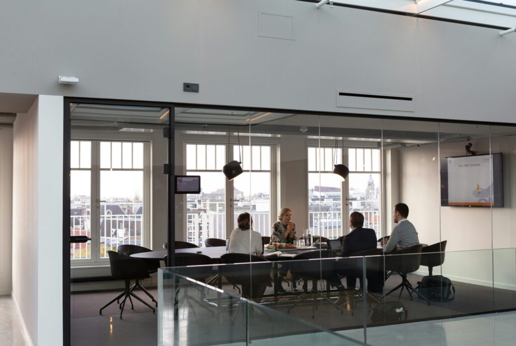 Group in modern office having a shareholders agreement meeting